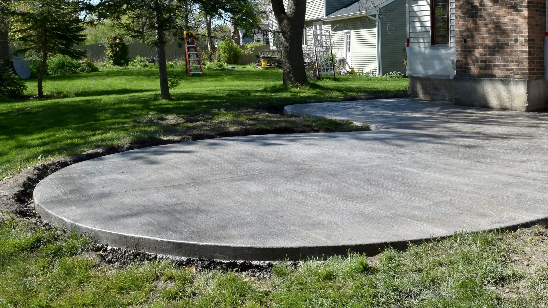Concrete Patio Design Options: Broom vs Stamped Finishes
