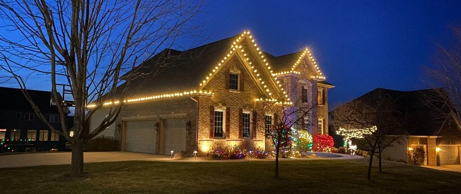 Colorful holiday lighting on a house in Waukee, IA.
