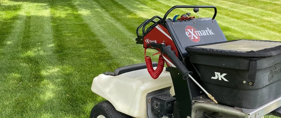 Fertilizer spreader on grass in Waukee, IA.
