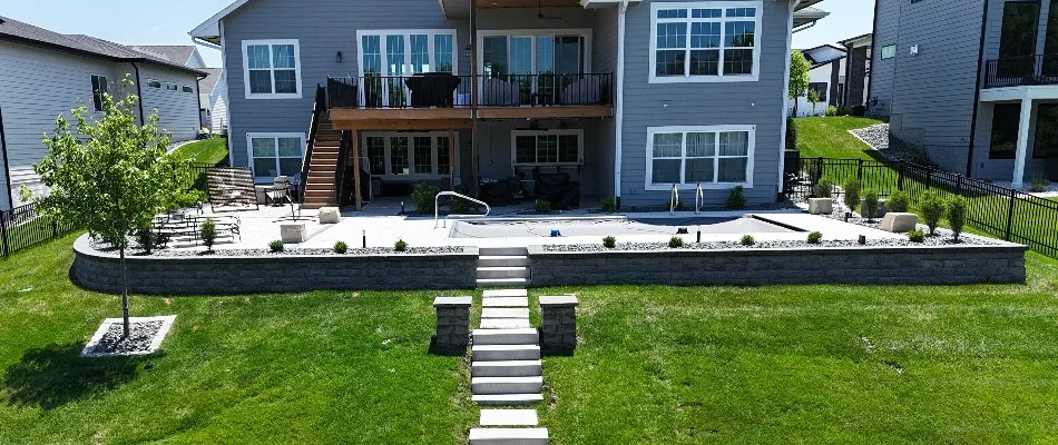 House in Waukee, IA, with retaining wall and outdoor steps.
