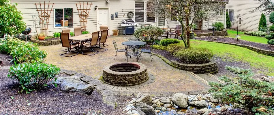 Outdoor living space in Waukee, IA, with a fire pit.