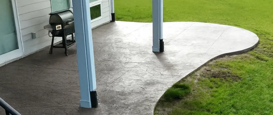 Patio in Waukee, IA, with a grill.