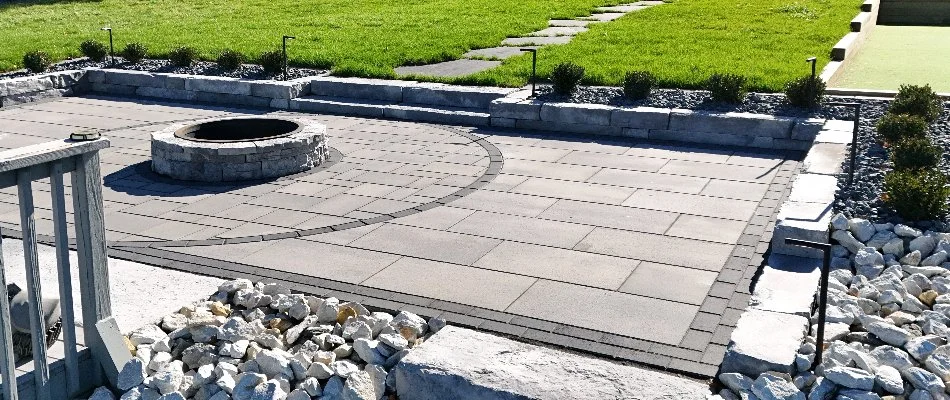 Paver patio in Waukee, IA, with a fire pit.