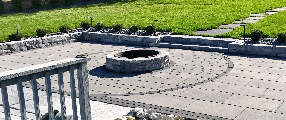 Paver patio with a round fire pit in Waukee, IA.
