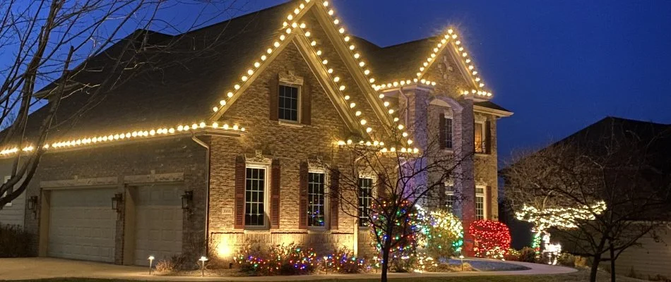 Residential property in Waukee, IA, with holiday lights.