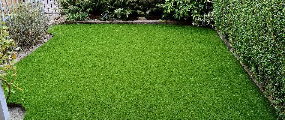 Artificial turf in a backyard area on a property in Waukee, IA.