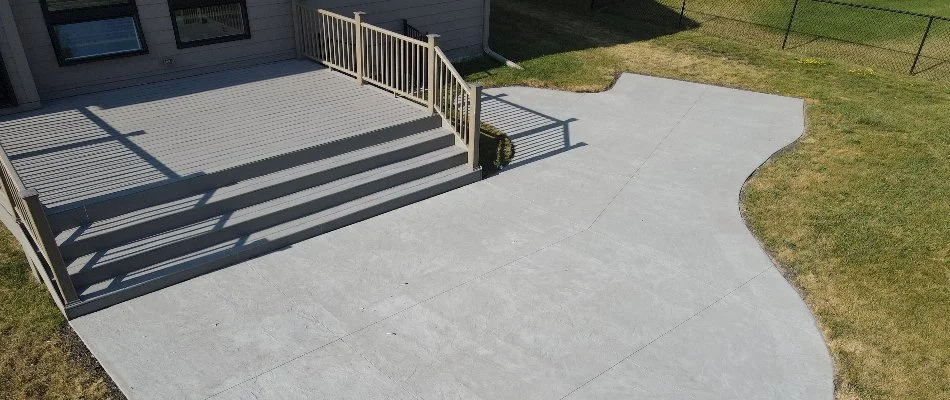 Small concrete patio on residential property in Windsor Heights, IA.