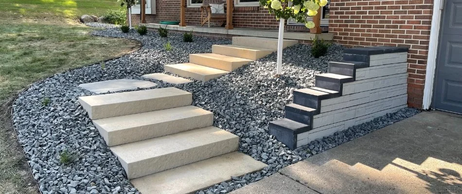 Concrete steps leading to a front door on a property in Waukee, IA.
