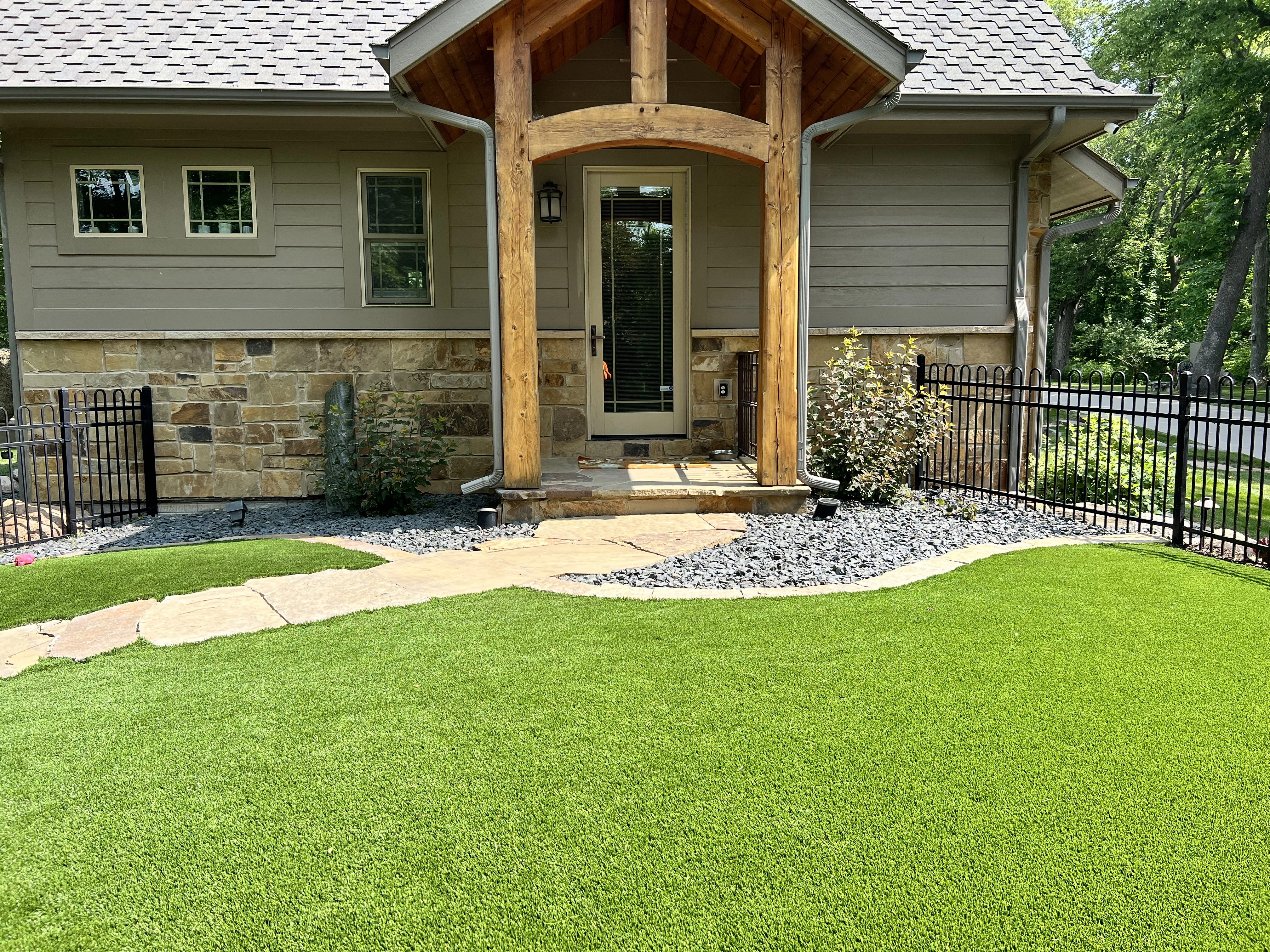 Artificial turf in a front yard area on a property in Waukee, IA.