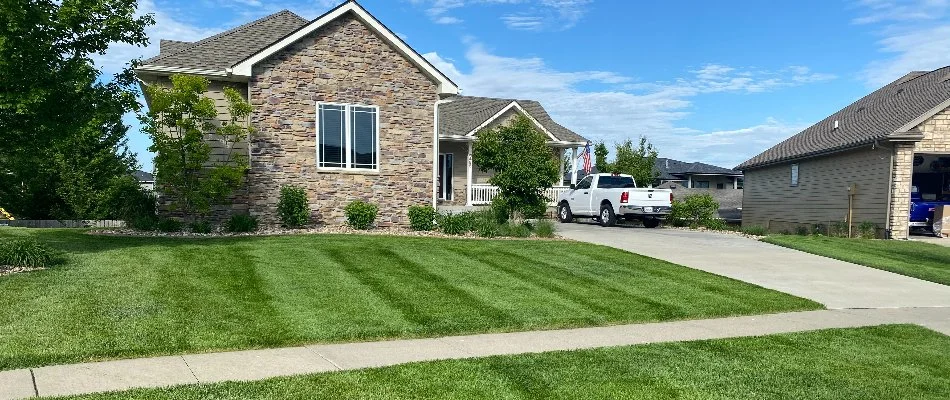 Healthy, green, fertilized lawn on a property in Waukee, IA.