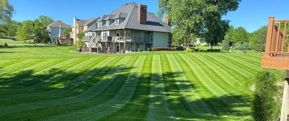 Lawn with mowing stripes on a property in Altoona, IA.