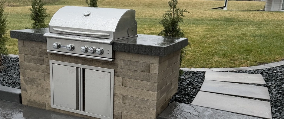 Outdoor kitchen and fireplace in Waukee, IA.