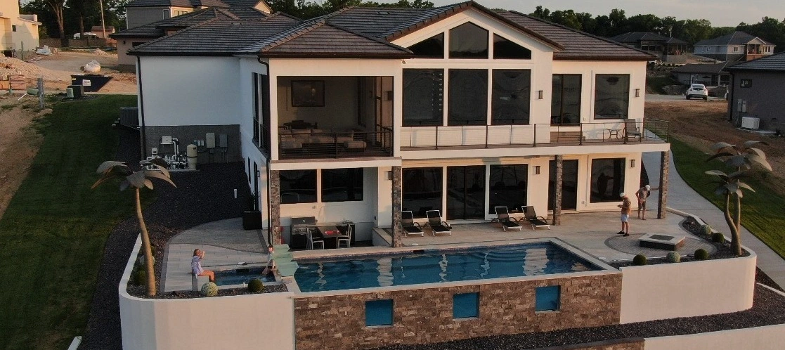 House in Waukee, IA, with a swimming pool.