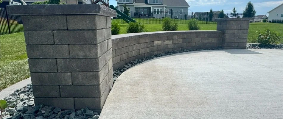 Patio area with seating wall on a property in Van Meter, IA.