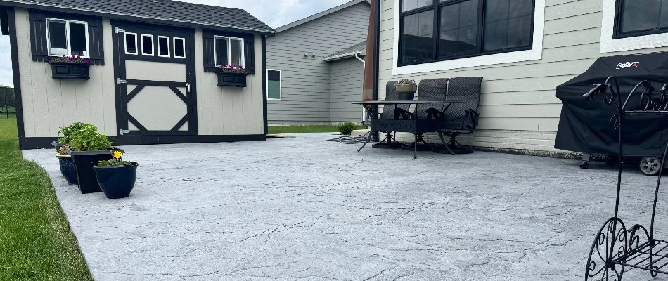 Patio with a shed on a property in Waukee, IA.