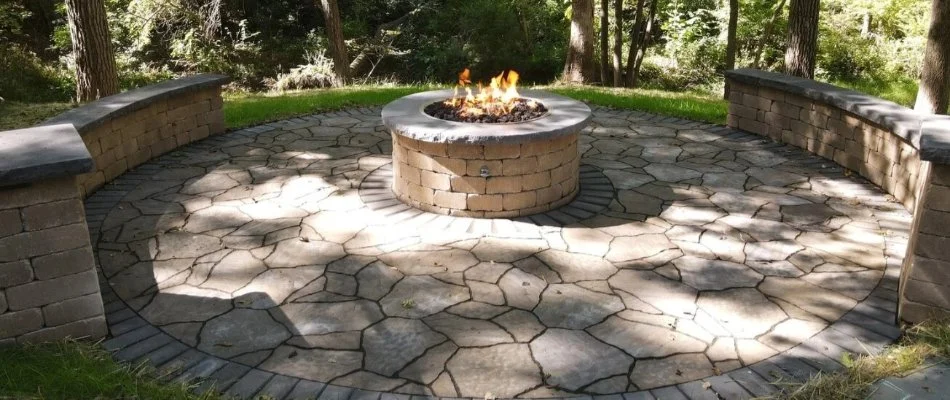 Patio, fire pit, and seating wall in Bondurant, IA.
