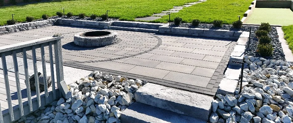 Paver patio and fire pit on a property in Minburn, IA.