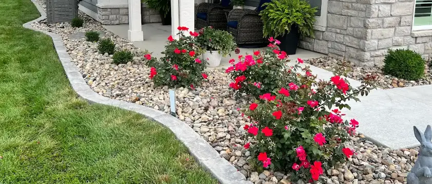 Residential landscape beds with rock ground cover in Waukee, IA.